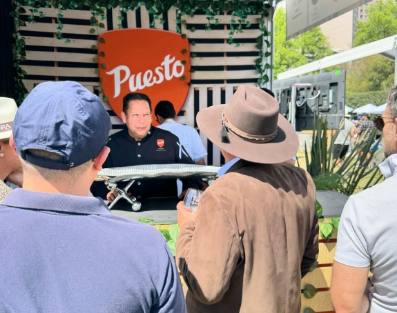 El Faro Seafood team networking at Puesto event in San Diego.